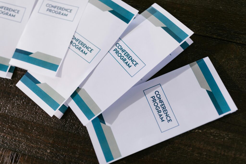 Conolly Printed Business paper Sheets and Pamphlets on a dark background